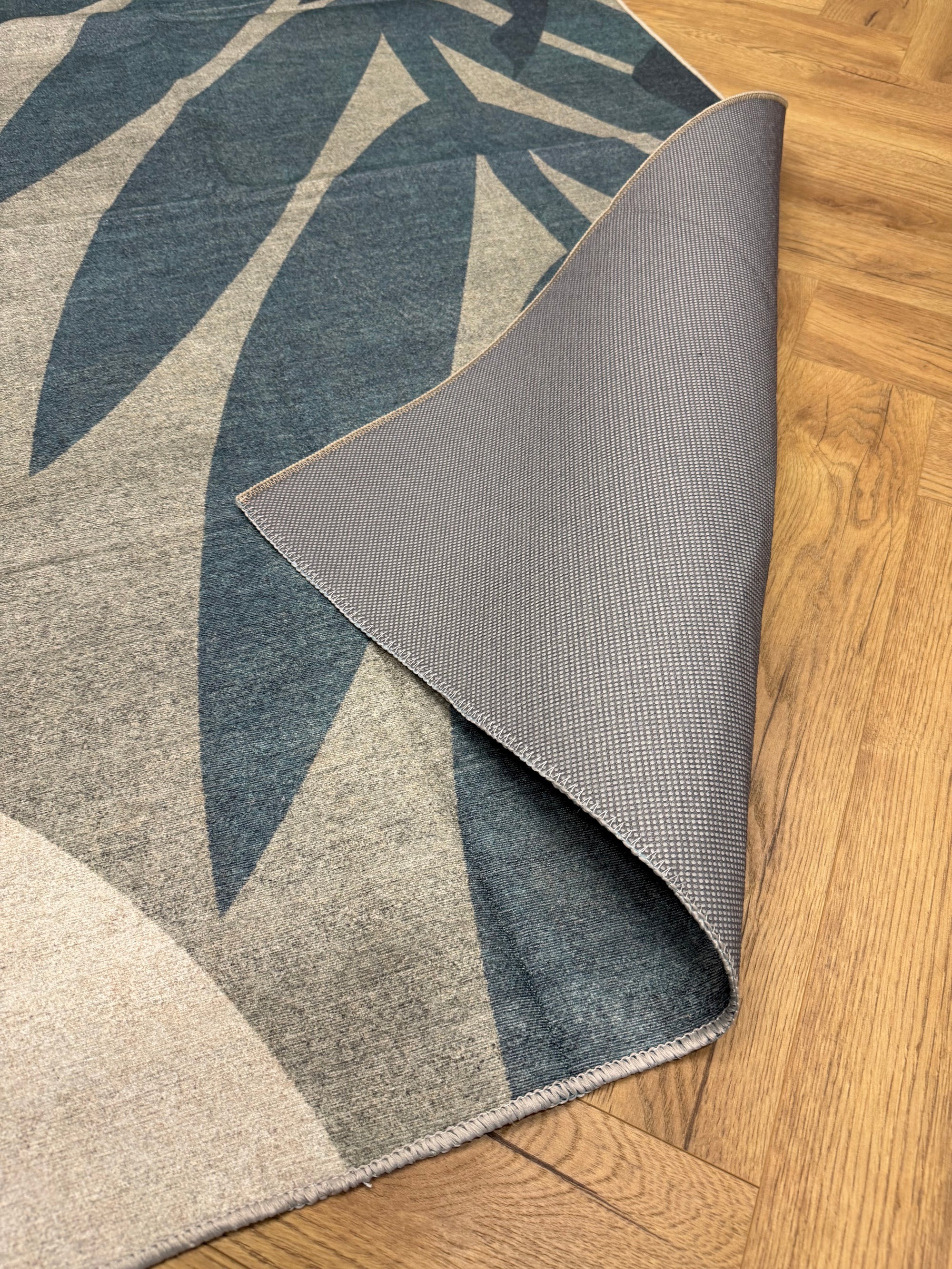 Vela Blue Leaf Machine Washable Rug